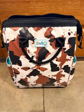 Swig Cooler Bag in “Hayride” Cow Print